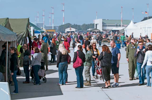 Ramstein Welfare Bazaar patrons wait in line to order food from the outdoor food vendors Sept. 13. The food court was entirely manned by Airmen and family volunteers from private organizations.