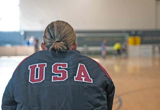 The U.S. Air Forces in Europe and Air Forces Africa woman’s soccer team coach watches as the team plays during the Headquarters Allied Air Command Indoor Football Championship. The HQ AIRCOM overall championship tournament consists of eight sports. Football closed out the 2013 tournament.