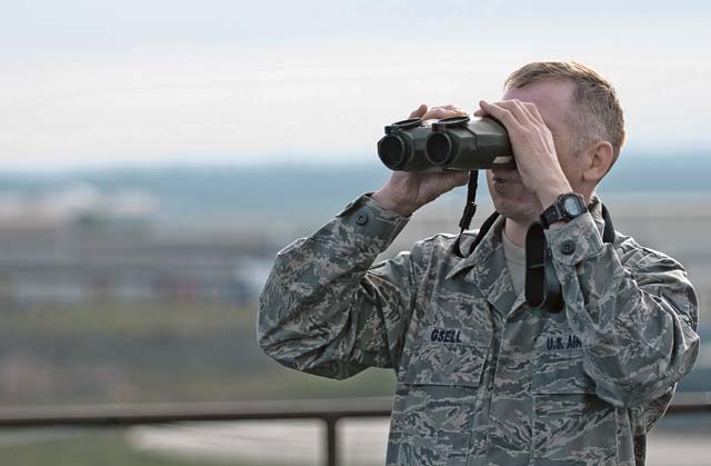 Staff Sgt. Albert Gsell, 86th Operations Support Squadron weather flight weather forecaster, uses a laser range finder to determine visibility levels Sept. 27 on Ramstein. 