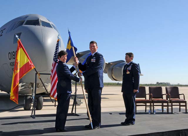 Photo by Mass Communication Specialist 2nd (SW) Grant WamackCol. Timrek C. Heisler receives the 521st Air Mobility Group guidon from Col. Nancy M. Bozzer, commander of the 521st Air Mobility Operations Wing, during a change of command ceremony at Naval Station Rota, Spain. Col. Carlos H. Ortiz (right) relinquished command  of the 521st AMOG to Heisler during the ceremony.