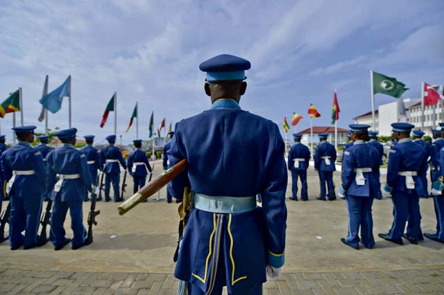 Photo by Airman 1st Class Jordan CastelanThe Ghanaian air force guard of honor awaits the arrival of the 2013 Regional Air Chiefs Symposium official party Aug. 20, 2013, in Accra, Ghana. The Ghanaian air force opened the 2013 Regional Air Chiefs Symposium with a traditional troop guard ceremony to honor the senior ranking officer in attendance.  
