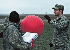 First Lt. Orlando R. Zambrano, an operations officer with the 2nd Battalion, 503rd Infantry Regiment, 173rd Airborne Brigade Combat Team, translates instructions for measuring wind conditions into French for a delegation of soldiers from Africa during Central Accord 14 Phase I Feb. 5 on Drop Zone Alzey.