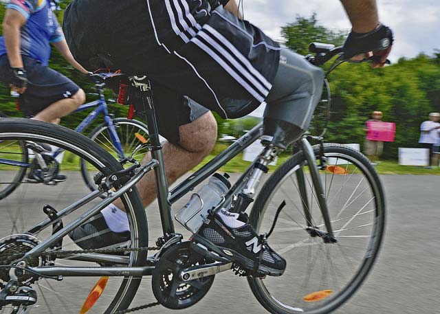 Photo by Airman 1st Class Jordan CastelanA wounded warrior alumnus finishes a 14-mile ride around the German countryside to raise money and awareness for wounded warriors Aug. 10, 2013, at Bostalsee, Germany. The Soldier Ride was a unique four-day cycling opportunity for wounded warriors to use cycling and the bonds of service to overcome physical, mental or emotional wounds. 