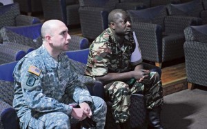 Capt. Thomas F. Torchia (left), Central Accord 14 Phase I OIC assigned to the 173rd Airborne Brigade Combat Team, watches a medical training video with Cameroonian army Capt. Assam Guy Francis Amour Feb. 4 on Rhine Ordnance Barracks.