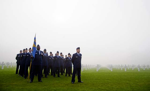 Photo by Senior Airman Damon KasbergMembers of the 86th Munitions Squadron stand at parade rest during a Veterans Day ceremony Nov. 11, 2013, at the Luxembourg American Cemetery and Memorial, Luxembourg. The cemetery holds the remains of 5,076 American service members, most of whom died during the Battle of the Bulge. 