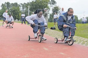 Photo by Tech. Sgt. Daylena S. RicksTricycle riders speed to their partners during the tricycle relay race during Resilience Day on Ramstein.