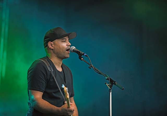 Photo by Senior Airman Jonathan Stefanko A live performer sings during “The Rockin’ 4th” celebration July 4 on Ramstein.