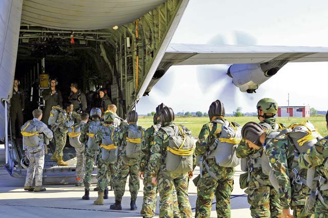 Photo by Airman 1st Class Trevor RhynesBulgarian paratroopers board a C-130J Super Hercules prior to a wing exchange jump July 17, 2013, in Plovdiv, Bulgaria. American and Bulgarian paratroopers exchanged parachutes for the opportunity to conduct a wing exchange at the end of Thracian Summer. 