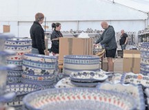 Ramstein bazaar volunteers set out Polish pottery to be sold at the Ramstein bazaar.