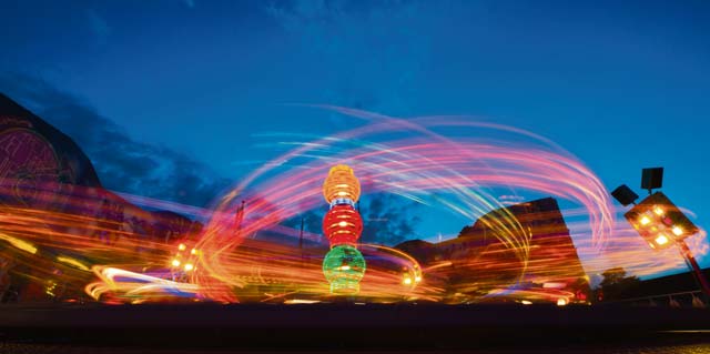 Photo by Senior Airman Jonathan StefankoA carnival ride spins during “The Rockin’ 4th” celebration July 4.