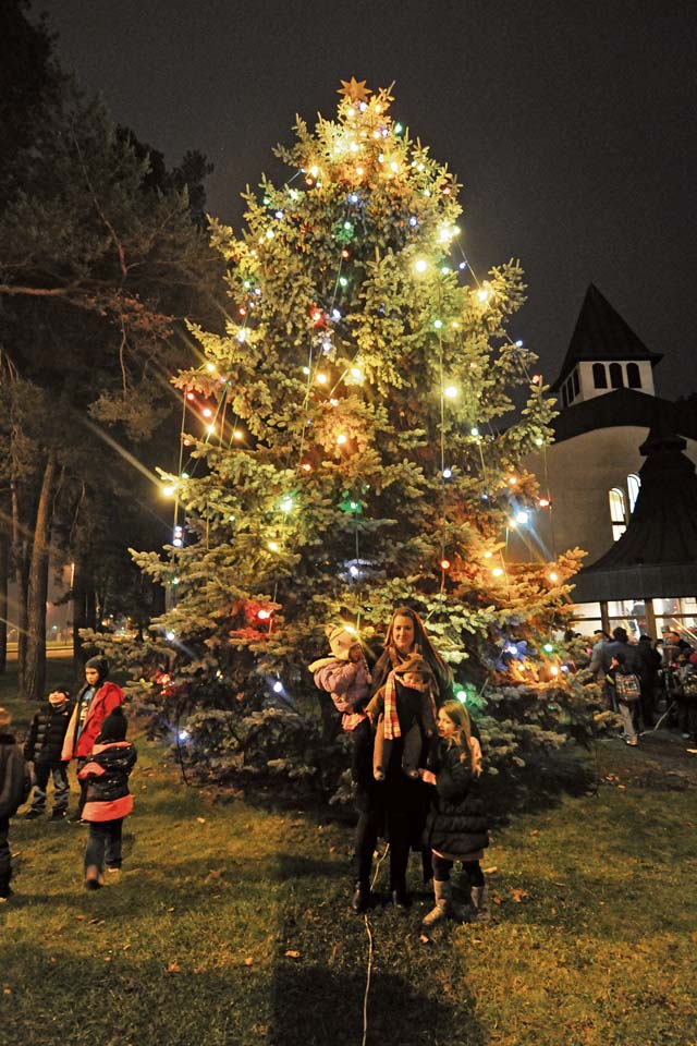 Photo by Senior Airman Chris WillisKMC members take part in the lighting of the Christmas tree on Kapaun Air Station Dec. 3.