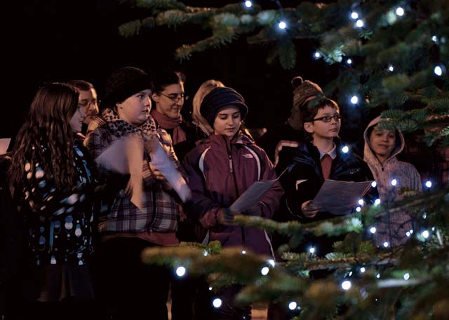 Photo by Staff Sgt. Kris LevasseurRamstein children sing Christmas carols for the crowd during the 2013 Ramstein Christmas Tree Lighting  ceremony Dec. 3 on Ramstein. The children and their families gathered to celebrate the holiday season.