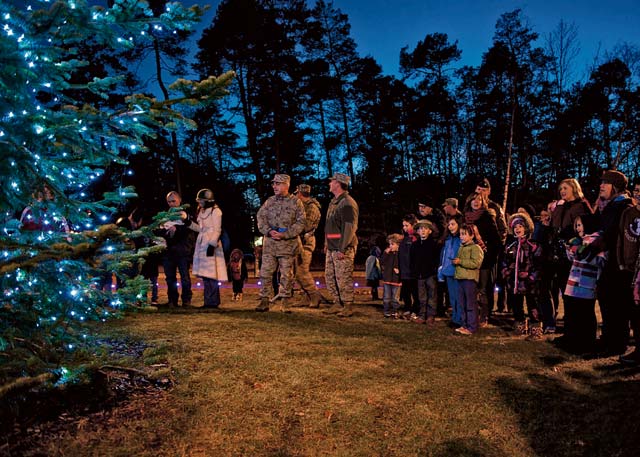 Photo by Staff Sgt. Kris LevasseurRamstein members witness the first glow of the lights during the 2013 Ramstein Christmas Tree Lighting ceremony. 