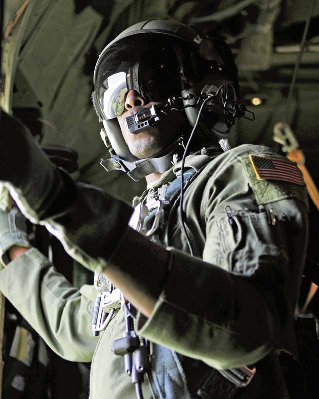 Airman 1st Class Ralph Colas, 37th Airlift Squadron loadmaster, waits for the OK to allow U.S. Army Soldiers from the 1-91 Cavalry Regiment, 173rd Infantry Brigade Combat Team (Airborne), Grafenwöhr, Germany, to jump over Estonia July 8.