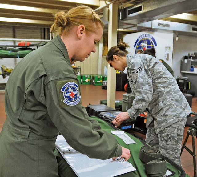 Staff Sgt. Lindsay Rhodes (left) and Senior Airman Amber Wingate, 86th Aeromedical Evacuation Squadron aeromedical evacuation technicians, inventory flight medical equipment used during an incoming flight Feb. 20. Members of the 86th AES are responsible for loading injured service members and other government personnel onto aircraft to provide medical care until arriving at a hospital.