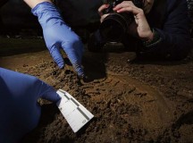 A footprint in mud is measured and photographed similar to the way an Air Force Office of Special Investigations criminal investigator would collect evidence. The U.S. Air Forces in Europe and Air Forces Africa OSI criminal investigators use many different detailed methods to collect evidence and intelligence to solve crimes.