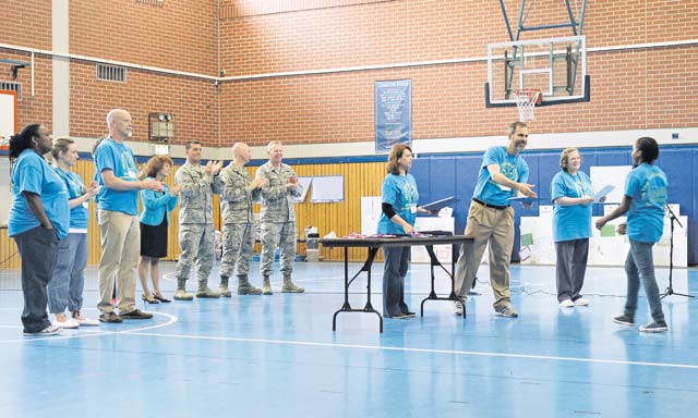 Photo by Senior Airman Jose L. LeonA student receives a certificate for participating in the STEMposium May 8 on Ramstein. The STEMposium provided various science, technology, engineering and math exercises to teach children technical skills to prepare them for future job opportunities.