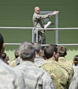 Photo by Airman 1st Class Michael StuartU.S. Air Force Tech. Sgt. Brian Angell, 435th Contingency Response Group personnel parachute program manager, directs people from different nations during International Jump Week May 4 at Rhine Ordnance Barracks. More than 300 jumpers from nine different nations performed a total of 404 static-line jumps and 132 high-altitude low-opening jumps in three days.