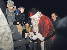 Photo by Airman 1st Class Larissa GreatwoodSanta Claus greets children during the tree lighting ceremony Dec. 1 on Ramstein. The event consisted of musical performances, the tree lighting ceremony, a meet-and-greet with Santa, and cookies and hot cocoa.