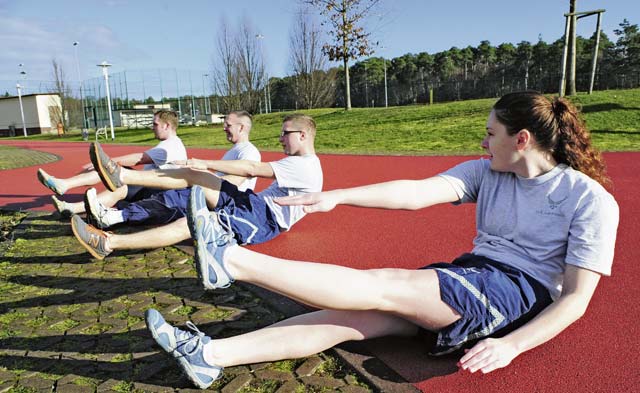 Airman 1st Class Chandler Marshall (right), 37th Airlift Squadron aviation resource management and certified physical training leader, trains with her unit during a workout session Jan. 17 on Ramstein. PTLs perform mock PT tests for their units, lead squadron-approved fitness programs, and they can provide assistance in the Fitness Assessment Cell to provide official testing to the installation. 