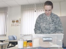 Second Lt. Lindsey Leitz, 86th Aerospace Medical Squadron Nutrition Program Manager, uses mock food to demonstrate the proper serving sizes July 28. Health Promotion, formerly known as the Health & Wellness Center, offers several nutrition classes including Healthy Eating, Hypertension and Heart Health.