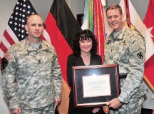 Evelyn Meaker (center), chief of information systems division for the Civilian Human Resources Agency Northeast/Europe Region, receives the William H. Kushnick Award from Maj. Gen. John R. O’Connor and Command Sgt. Maj. Sgt. Rodney J. Rhoades, 21st Theater Sustainment Command commanding general and command sergeant major, respectively, Jan. 27 on Panzer Kaserne.