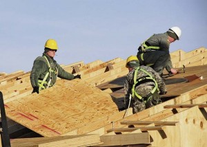 Soldiers with the 902nd Engineer Company (Vertical), 15th Engineer Battalion, 18th Engineer Brigade, 21st Theater Sustainment Command, place a board while building a roof during a construction project at the Mihail Kogalniceanu Air Base Passenger Transit Center Jan. 14.  The 902nd Eng. Co. is responsible for constructing new customs facilities to help streamline the inflow of Soldiers departing Afghanistan and other areas of operation around the world. 