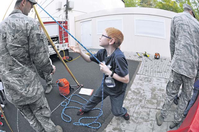 Courtesy photoNicholas Regis learns about fire and rescue services during the STEMposium May 8 on  Ramstein.