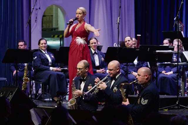 Staff Sgt. Jill Diem, U.S. Air Forces in Europe Band vocalist, sings during the annual KMC Christmas Concert at the Fruchthalle. The USAFE Band performs in hundreds of concerts throughout Europe and Africa every year, supporting the global Air Force mission and increasing Airmen morale.