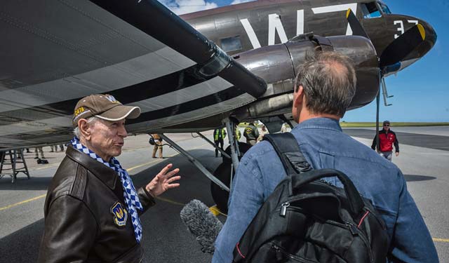 Photo by Airman 1st Class Jordan CastelanJulian “Bud” Rice, a pilot who flew on D-Day, answers questions from a reporter June 5, 2014, after a flight over Normandy inside a C-47 Skytrain that flew during D-Day. Over 60 Ramstein Airmen traveled to Normandy, France, to celebrate and honor the sacrifices made by veterans of World War II.