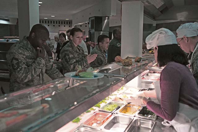 Rhineland Inn dining facility guests order food Nov. 28. The meal featured traditional items and was served by U.S. Air Forces in Europe and Air Forces Africa and 86th Airlift Wing leadership.