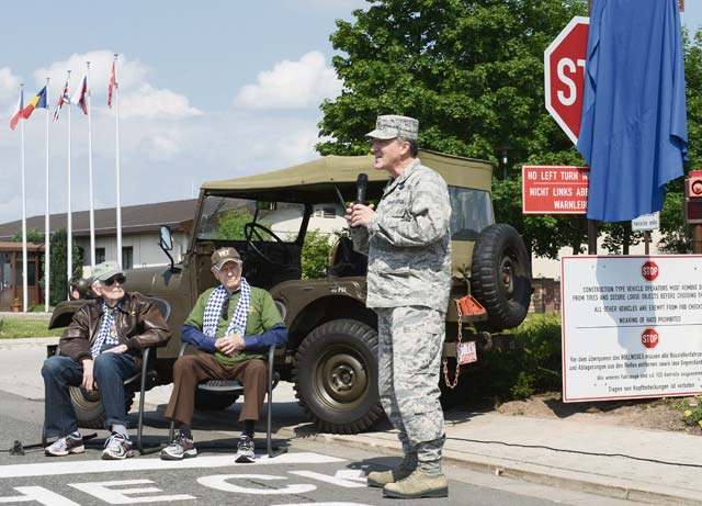 Photo by Staff Sgt. Travis EdwardsFormer World War II pilots William Prindible and Julian Rice listen as Brig. Gen. Patrick X. Mordente, 86th Airlift Wing commander, speaks about how important it is to remember the past in order to secure the future during a street-naming ceremony June 2, 2014, on Ramstein. The street was named Skytrain Lane after the C-47, the same kind of aircraft both Prindible and Rice flew during the D-Day invasion.