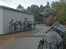 Senior Airman Jesse Koritar, 435th Security Forces Squadron Creek Defender cadre, looks ahead of his squad during an urban operations evaluation Oct. 17 in Baumholder, Germany.