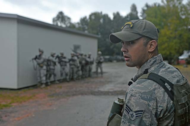 Senior Airman Jesse Koritar, 435th Security Forces Squadron Creek Defender cadre, looks ahead of his squad during an urban operations evaluation Oct. 17 in Baumholder, Germany.