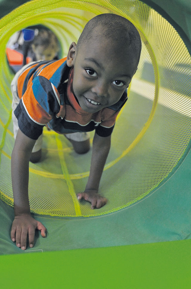 Photo by Airman 1st Class Jordan CastelanFSS offers funChristopher Robinson, 5, son of Sabrina Robinson, crawls through a tunnel during a youth gymnastics class offered by the 86th Force Support Squadron Sept. 4 on Ramstein. The 86th FSS provides quality of life enhancement activities and services to members of the KMC.