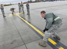 Airmen from the 786th Civil Engineer Squadron work on a static ground installation for parked aircraft.