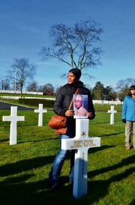 Photo by Capt. Royal ReffMaster Sgt. Angela Parker, senior human resources professional with Headquarters and Headquarters Battery, 10th Army Air and Missile Defense Command, holds a photograph of Congressional Medal of Honor winner Staff Sgt. Ruben Rivers during a visit to the Lorraine American Cemetery Monday in St. Avold, France. Rivers is one of only seven African-American Soldiers awarded the Medal of Honor for service during World War II.