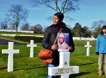 Photo by Capt. Royal ReffMaster Sgt. Angela Parker, senior human resources professional with Headquarters and Headquarters Battery, 10th Army Air and Missile Defense Command, holds a photograph of Congressional Medal of Honor winner Staff Sgt. Ruben Rivers during a visit to the Lorraine American Cemetery Monday in St. Avold, France. Rivers is one of only seven African-American Soldiers awarded the Medal of Honor for service during World War II.