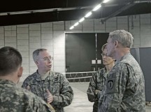 U.S. Army photoCol. Gregory Brady, 10th Army Air and Missile Defense Command commander, conducts an operations briefing with Col. Jennifer Spears, chief of staff, Joint Missile Defense Mission, and Maj. Gen. Richard Longo, deputy commanding general of U.S. Army Europe. Longo met with Soldiers from USAREUR and USAFE-AFAFRICA and participated in a 10th AAMDC-led joint missile defense exercise March 5 on Rhine Ordnance Barracks.