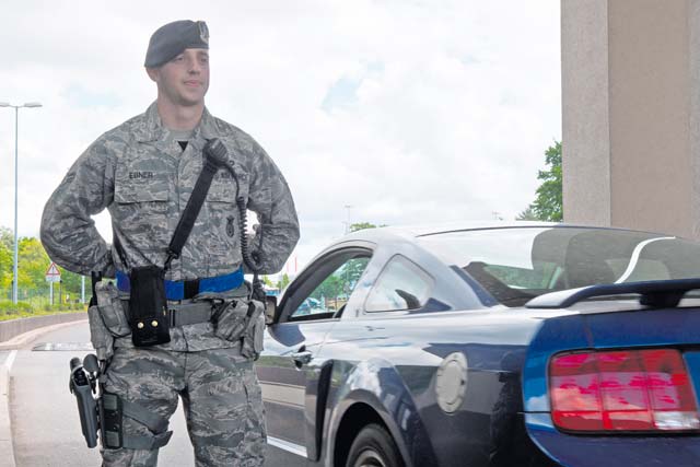 Airman 1st Class Jonathan Ebner, 86th Security Forces Squadro elite gate guard, stands at parade rest after controlling the entry of a vehicle May 23 on Ramstein. Defenders go through a rigorous selection process to be a member of the newly created Elite Gate Guard Section at Ramstein.