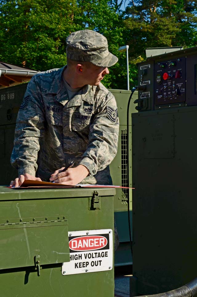 Courtesy photo1st CBCS powers AOCTech. Sgt. Richard Nunley, 1st Combat Communications Squadron technician,  inspects a generator providing continuous power to the 603rd Air and Space Operations Center during an upgrade to its backup power systems June 8 on Ramstein. The 1st CBCS supported the 603rd AOC with 24-hour manning in order to deliver uninterrupted communications to austere locations within Europe and Africa.