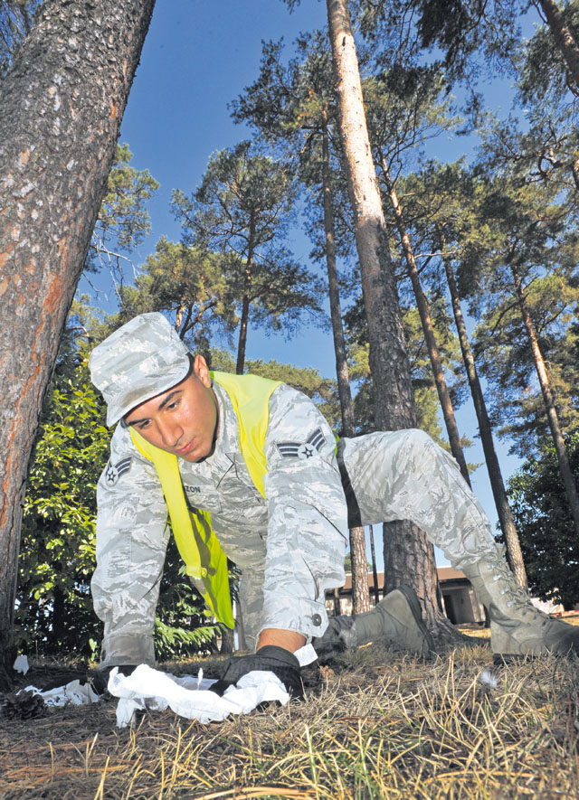 Photo by Senior Airman Aaron-Forrest WainwrightBay orderlySenior Airman Giovanni Pinzon, 86th Munitions Squadron ammunitions journeyman, picks up trash around the base as a part of bay orderly in September on Ramstein. Bay orderly is  implemented to maintain a clean and healthy living environment for Airmen in the dorms.