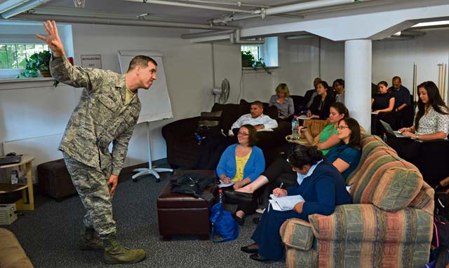 Photo by Airman 1st Class Jordan CastelanDTC visitMaster Sgt. Cory Hancock, Deployment Transition Center program NCOIC, speaks to students from the University of Southern California School of Social Work June 12 on  Ramstein. The USC School of Social Work offers the Center for Innovation and Research on Veterans and Military Families, which provides leading research and partnerships that improve the capacity and competency of mental health providers to effectively address the needs of wounded warriors and their families.