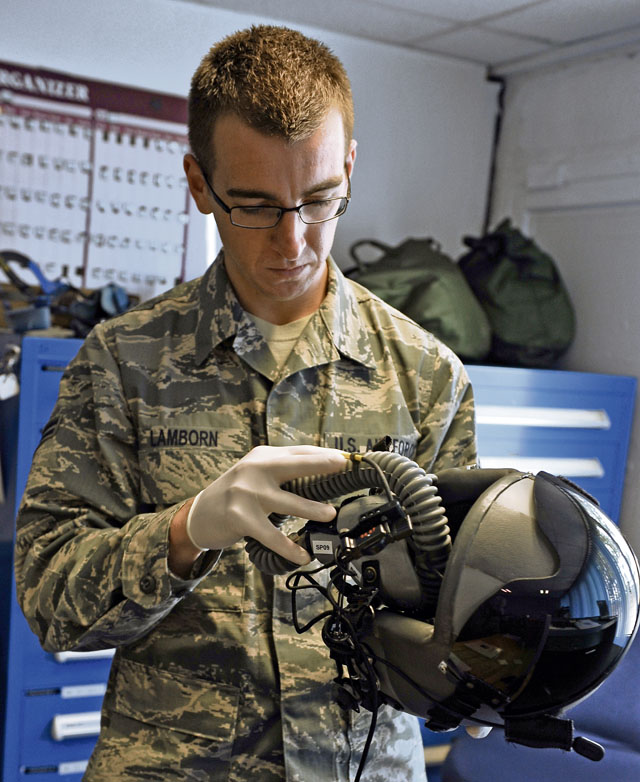 Photo by Airman Dymekre AllenAFEAirman 1st Class Brent Lamborn, 86th Operations Support Squadron aircrew flight equipment technician, inspects a helmet July 11 on Ramstein. The 86th OSS provides airfield operations management, air traffic control, weather services, intelligence support, combat tactics development and training, mission development and manages aircrew training support operations.