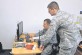 Computer mapping: Airmen 1st Class Brandon Beaty (left) and Todd Caldwell, 86th Communications Squadron 
client system technicians, map a computer to the network June 17 on Ramstein. Client 
system technicians sustain, troubleshoot and repair standard, data and video network 
devices.