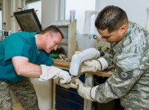 Photo by Maj. Julie JohnsonBrig. Gen Patrick X. Mordente (left), 86th Airlift Wing commander, and Tech. Sgt. Pompilio Alfaro Jr., 86th Medical Support Squadron brace shop NCOIC, pull plastic over a patient’s leg mold to create an ankle foot orthotic device for drop foot during a Landstuhl Regional Medical Center visit Sept. 27. This device is used to control instabilities in the lower limb by maintaining proper alignment and controlling motion.