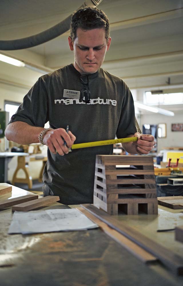 Mark Zasztowt, Arts and Crafts Center woodshop wood crafter, creates a going away gift  April 23 on Ramstein. The woodshop is one of several things people around the KMC can utilize at the Arts and Crafts Center.