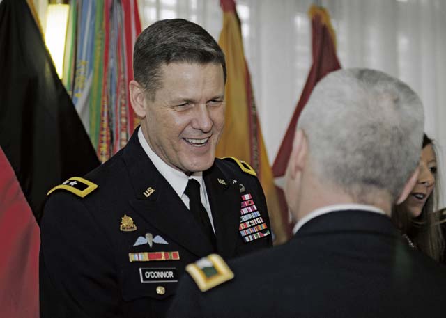 Maj. Gen. John R. O’Connor, commanding general of the 21st Theater Sustainment Command, greets guests as they arrive at the 2015 21st TSC New Year’s Reception Jan. 9 on Vogelweh.