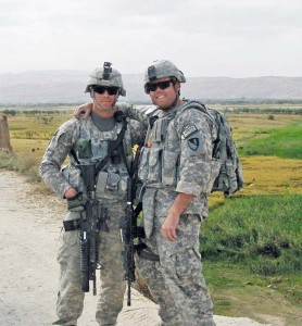 Sgt. Shayne Merritt (right) poses with Sgt. Shane Hawkins while deployed to Afghanistan where Merritt served as a medic and received the Combat Medical Badge for medical aid rendered under enemy fire.