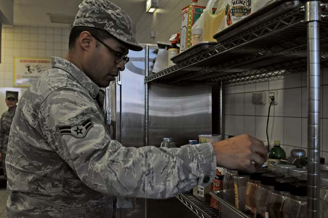 Airman 1st Class Christopher Blount, 86th Medical Group public health technician, inspects spices Oct. 1 at the dining facility on Ramstein to ensure they are properly stored. Members of the food safety and sanitation office help ensure military members and their families are eating properly made food in clean and safe facilities.